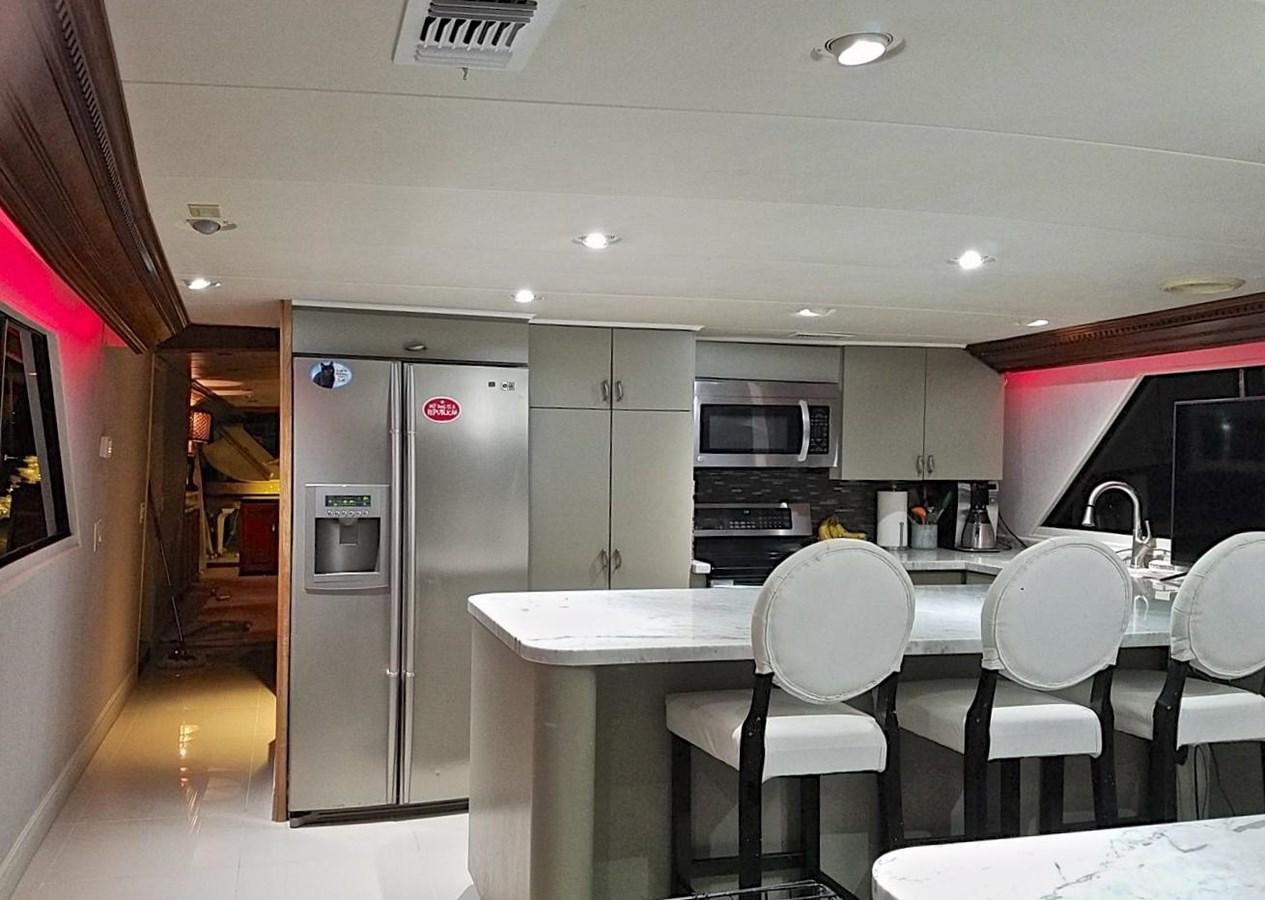 a kitchen with white cabinets aboard ISABELLA Yacht for Sale