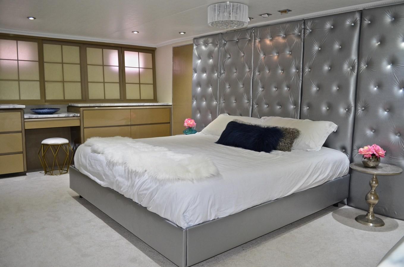 a bedroom with a large bed aboard ISABELLA Yacht for Sale