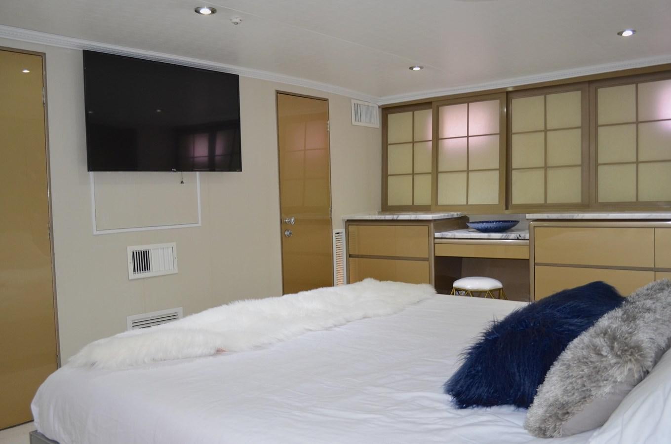 a bedroom with a bed and a tv aboard ISABELLA Yacht for Sale