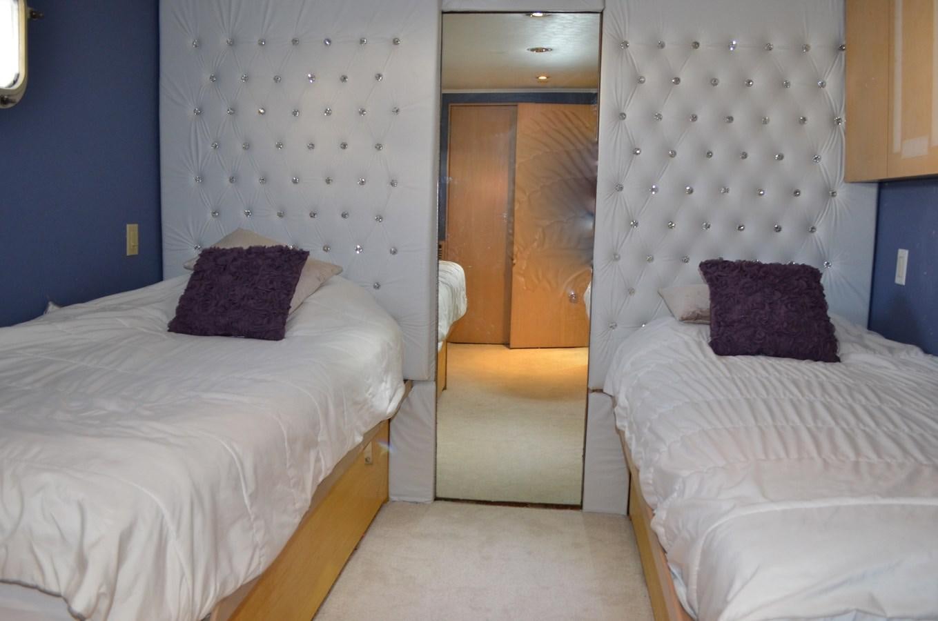 a room with a bed and a chair aboard ISABELLA Yacht for Sale