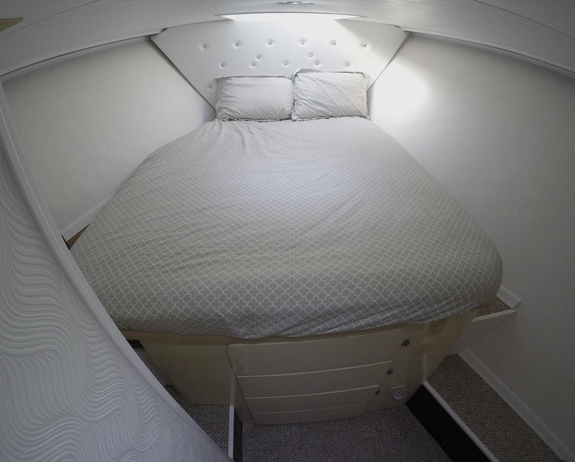 a bed with white sheets aboard ISABELLA Yacht for Sale