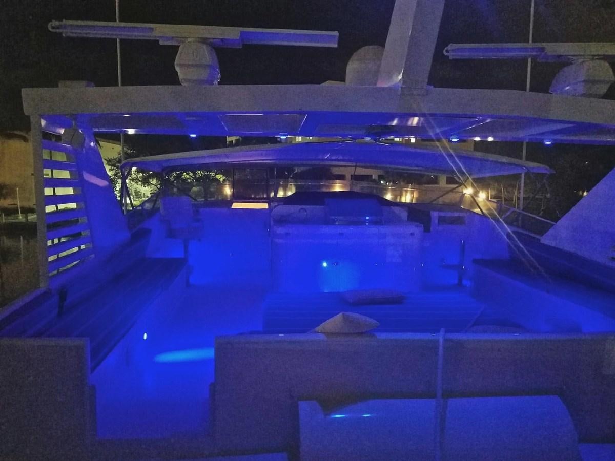 a large room with a large blue stage and a large white piano aboard ISABELLA Yacht for Sale