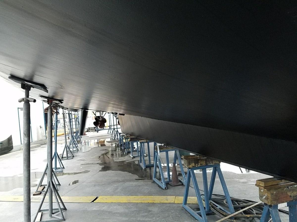 a person working on a large machine aboard ISABELLA Yacht for Sale