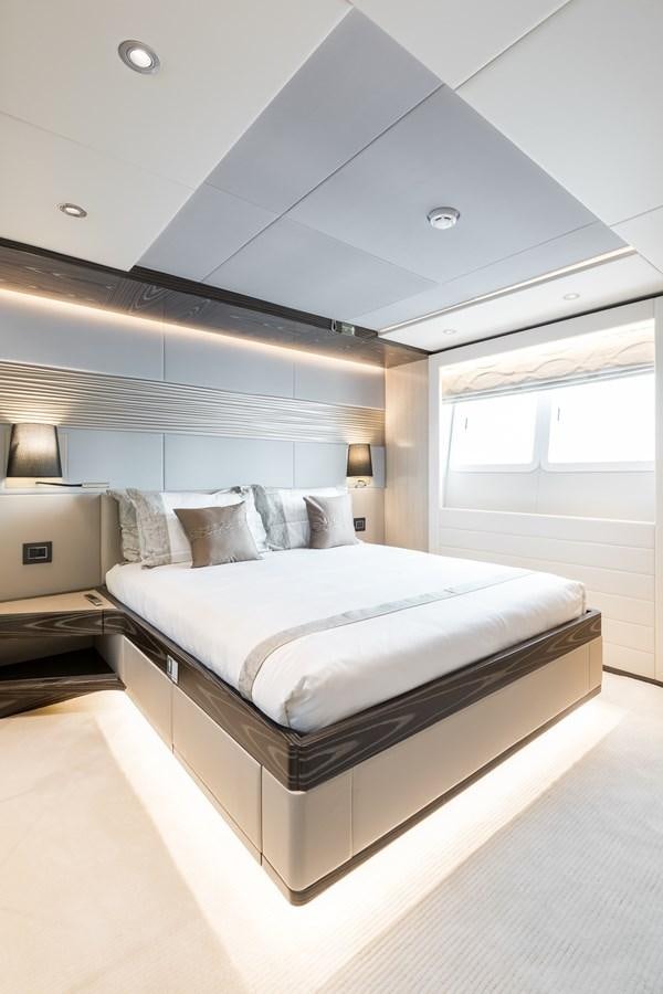 a bed in a room aboard LEGACY Yacht for Sale