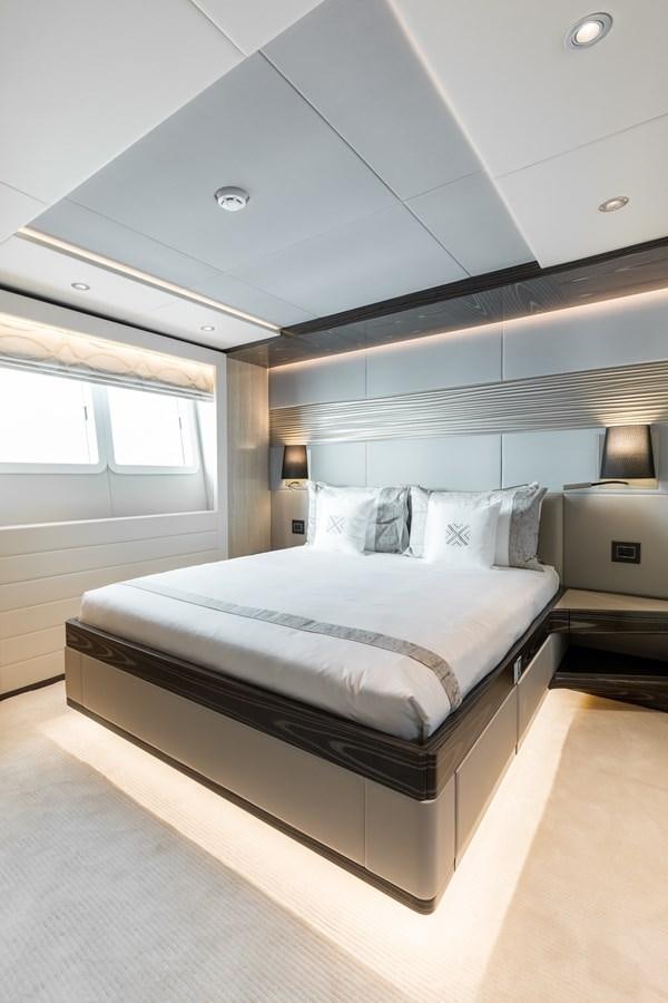 a bed in a room aboard LEGACY Yacht for Sale