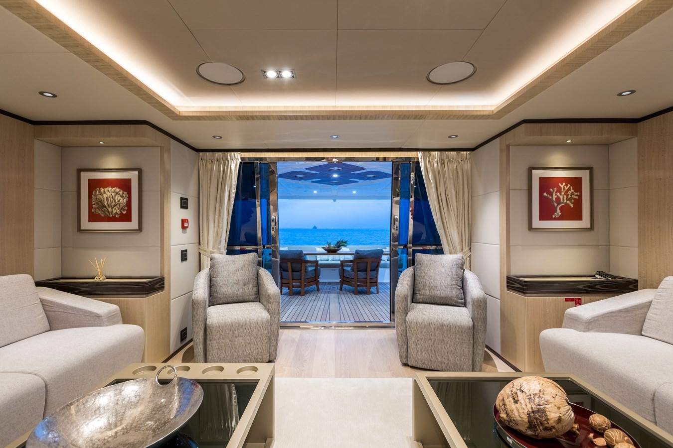 a living room with a large blue window aboard LEGACY Yacht for Sale