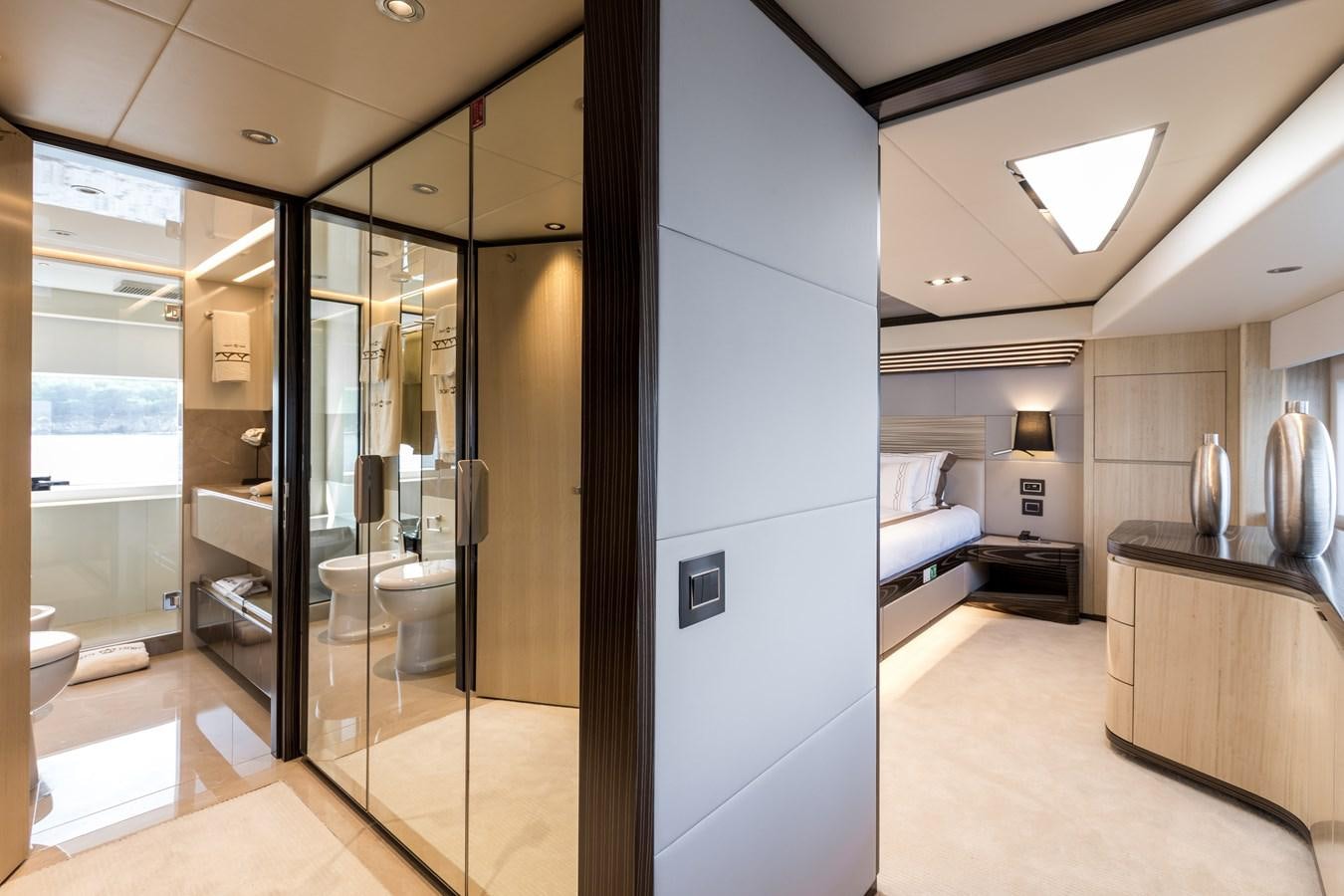 a bathroom with a glass shower aboard LEGACY Yacht for Sale