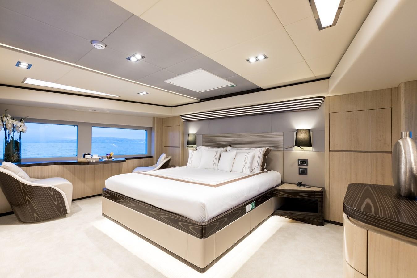 a large bedroom with a large bed aboard LEGACY Yacht for Sale