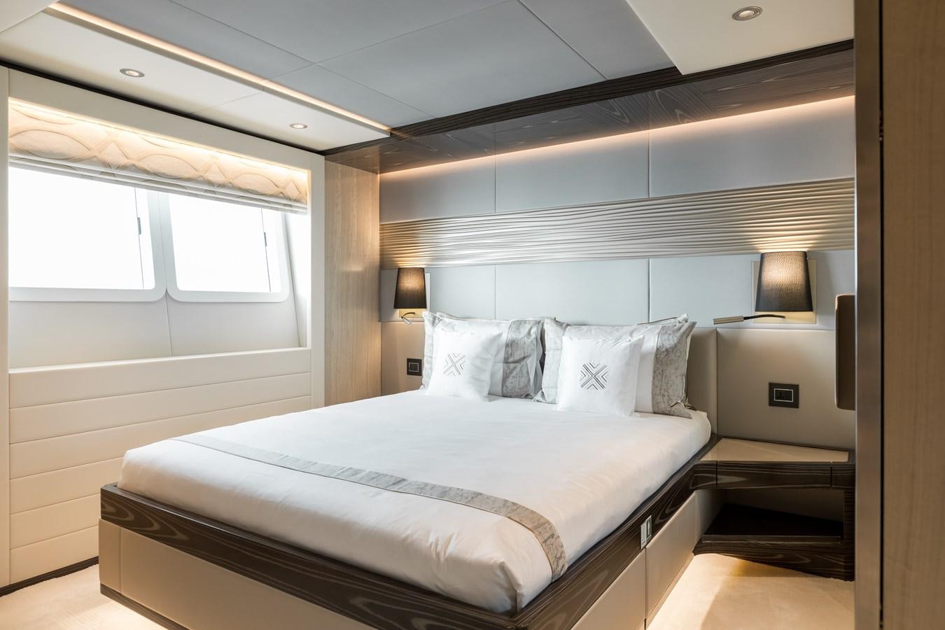 a bed in a room aboard LEGACY Yacht for Sale