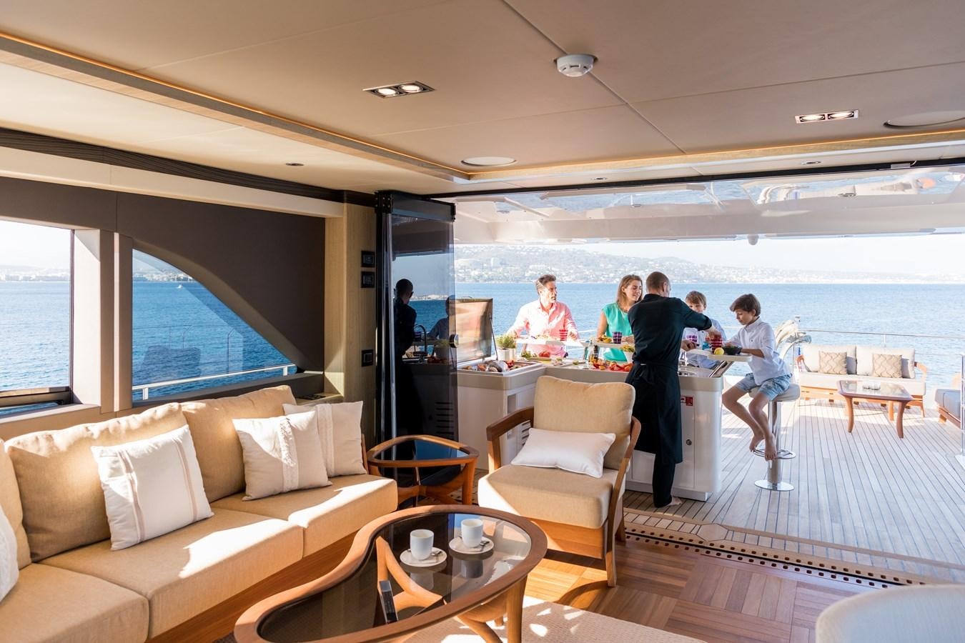 a group of people walking on a deck of a boat aboard LEGACY Yacht for Sale