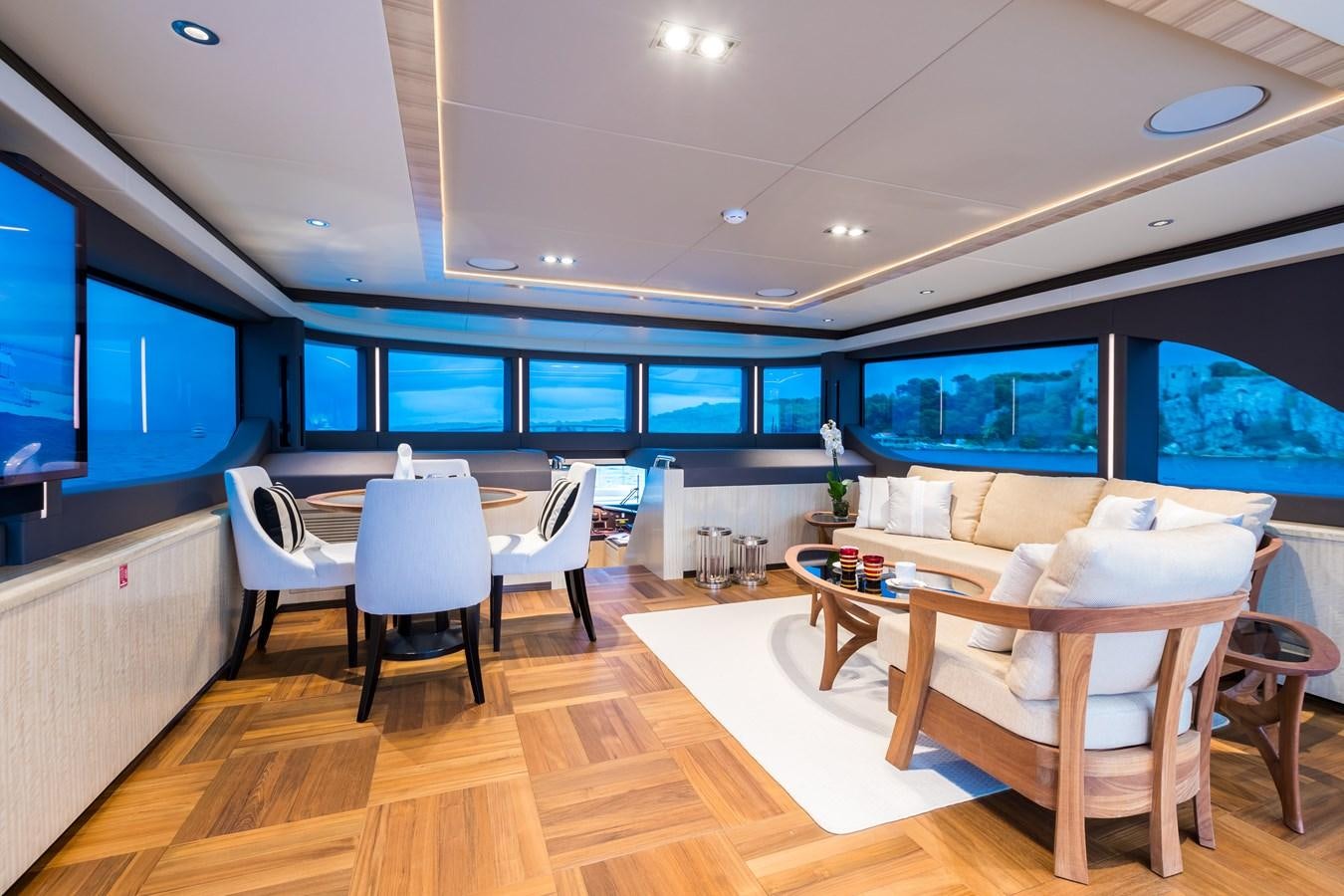 a room with a table and chairs aboard LEGACY Yacht for Sale