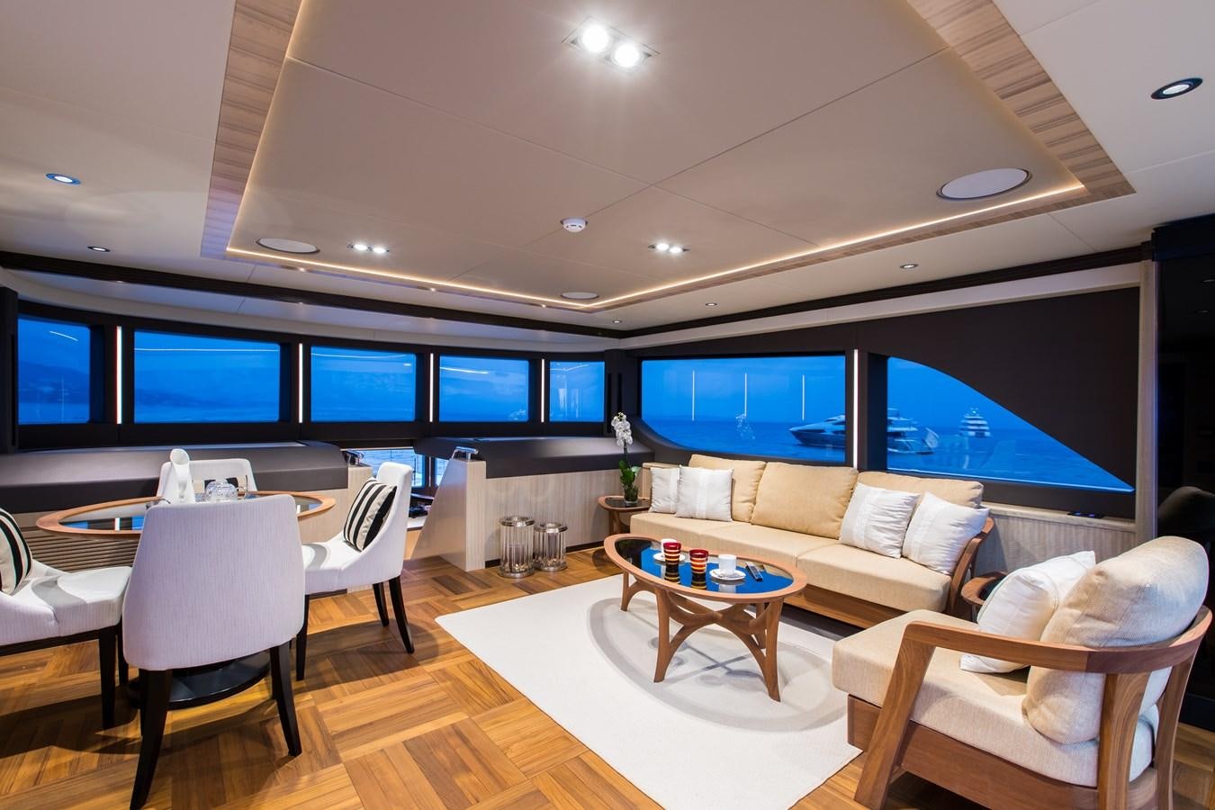 a room with a table and chairs aboard LEGACY Yacht for Sale