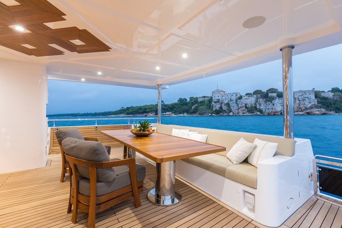 a table and chairs in a room aboard LEGACY Yacht for Sale