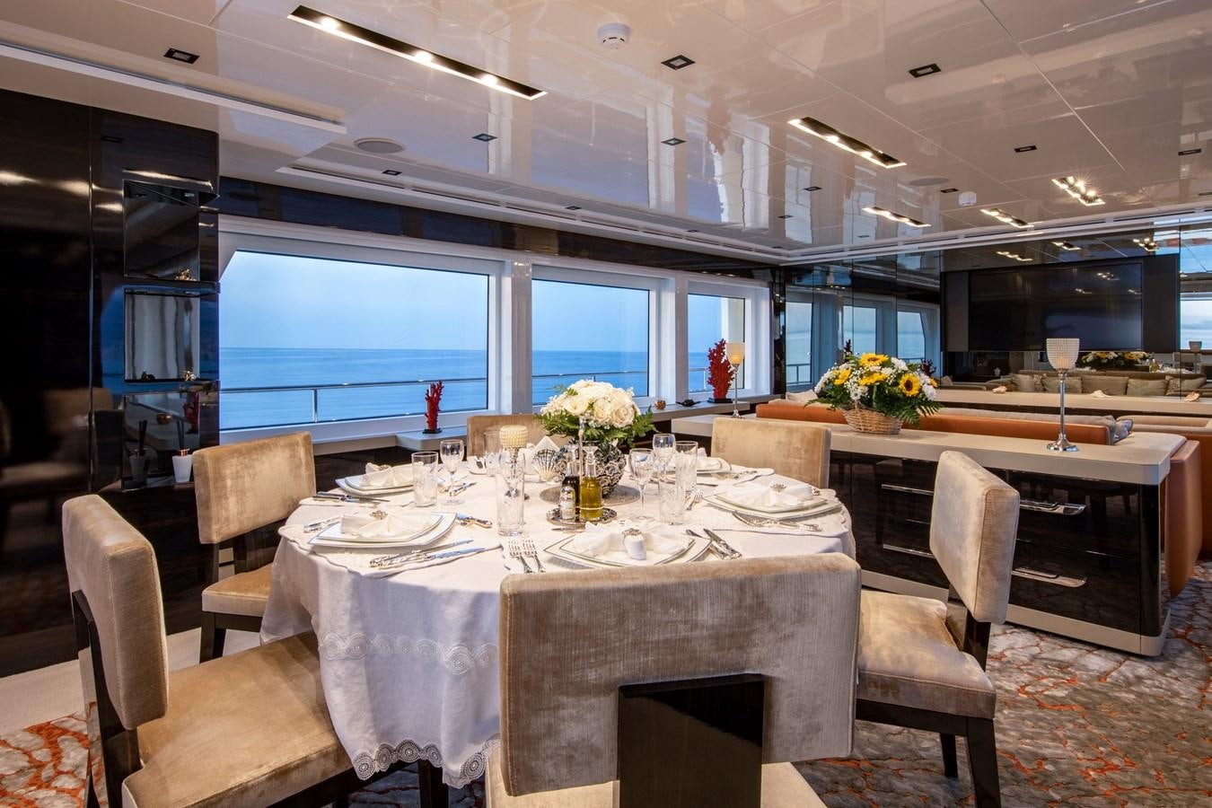 a dining room with a table and chairs aboard OCEAN DREAM Yacht for Sale