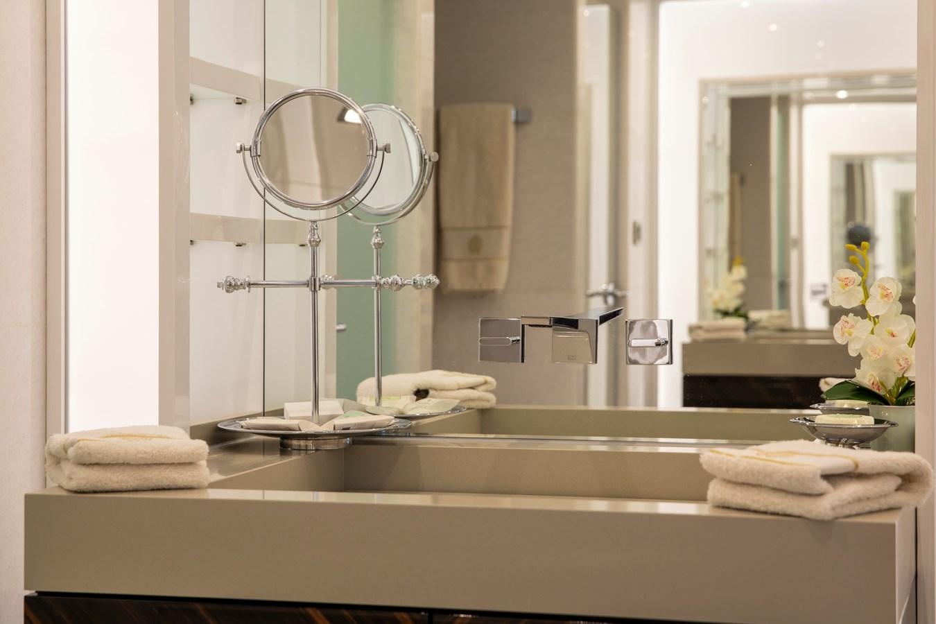 a bathroom with a large mirror aboard OCEAN DREAM Yacht for Sale