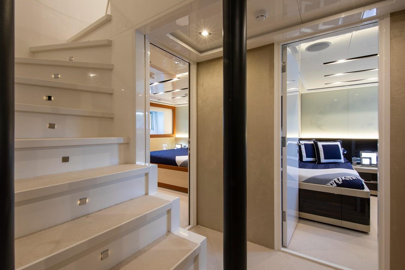 a room with a bed and a desk aboard OCEAN DREAM Yacht for Sale