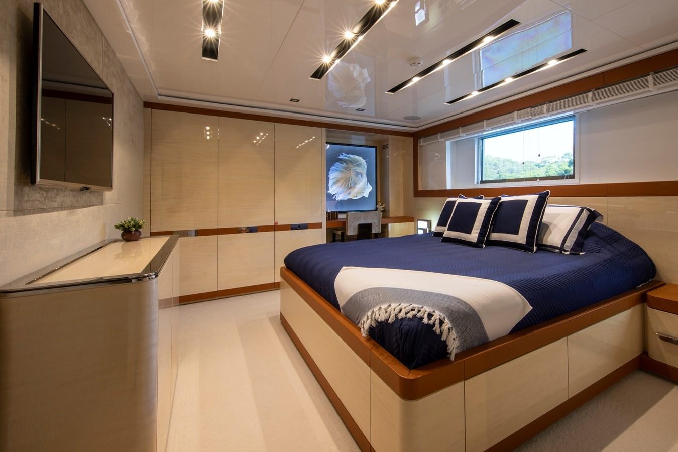 a room with a bed and a window aboard OCEAN DREAM Yacht for Sale