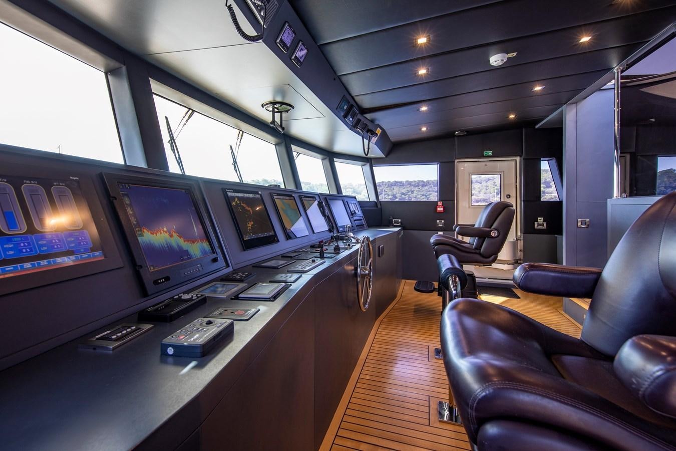 a room with many monitors aboard OCEAN DREAM Yacht for Sale