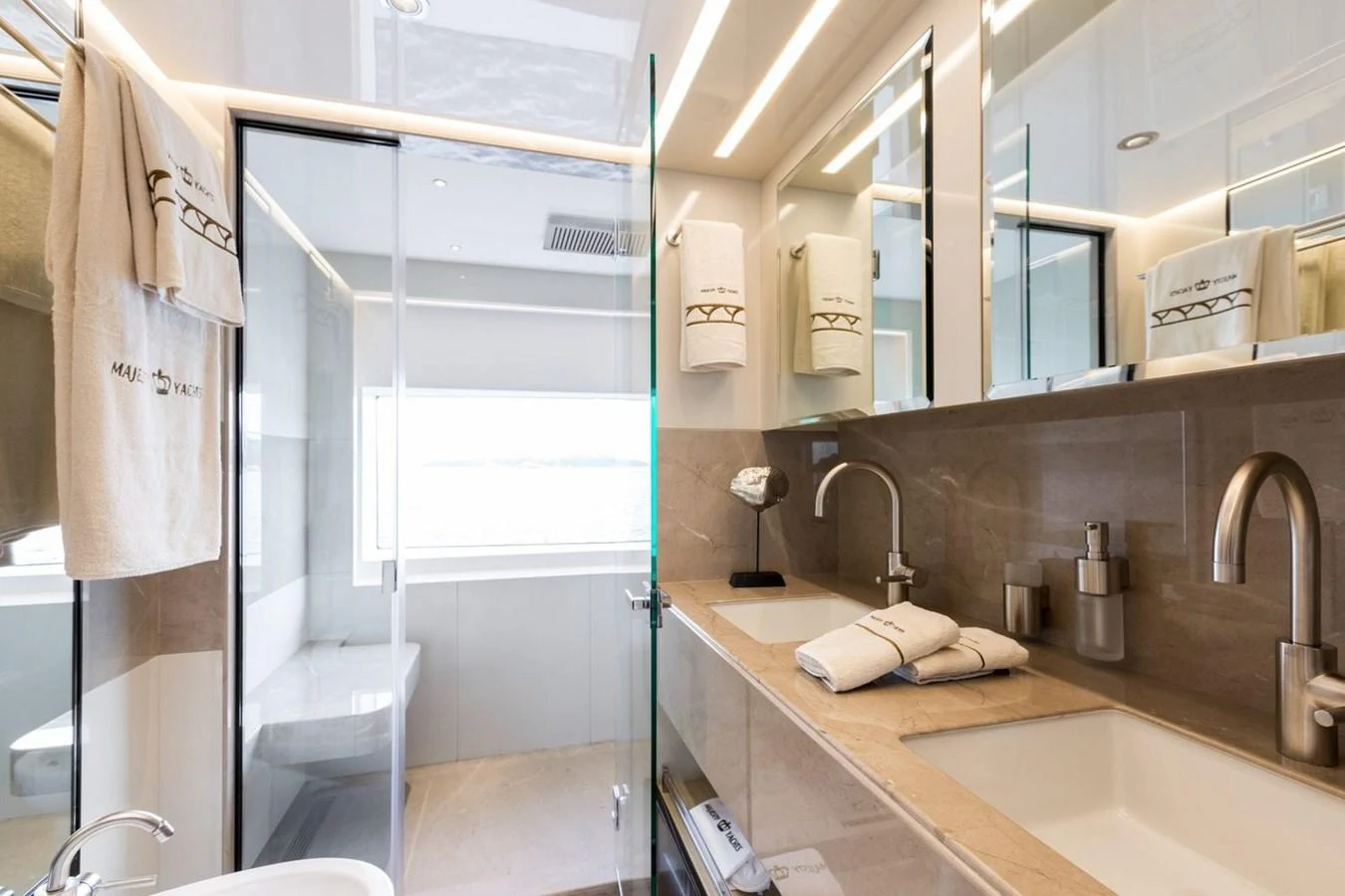 a bathroom with a glass shower aboard BARBARA Yacht for Sale