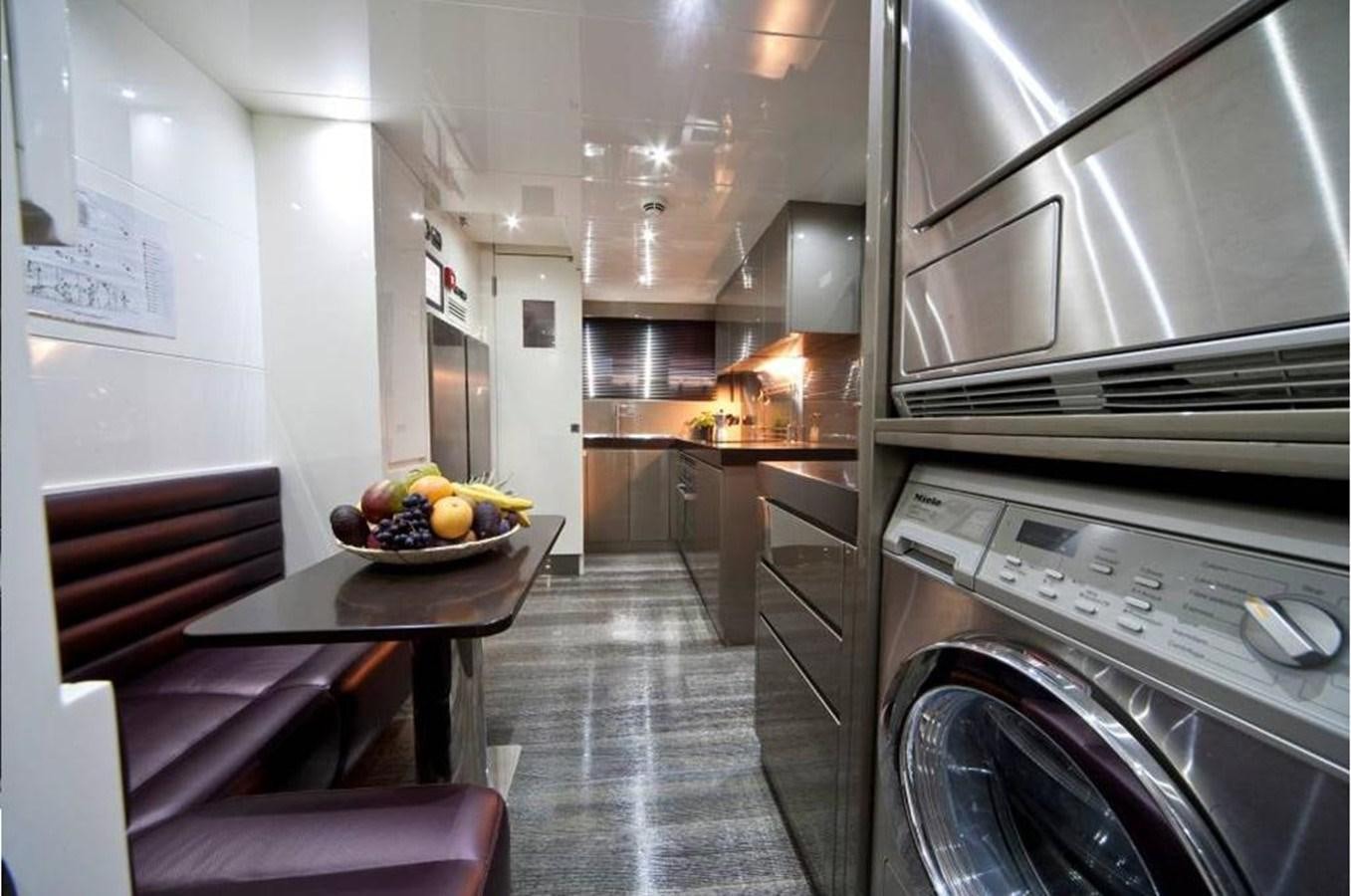 a kitchen with a bowl of fruit aboard TOBY Yacht for Sale