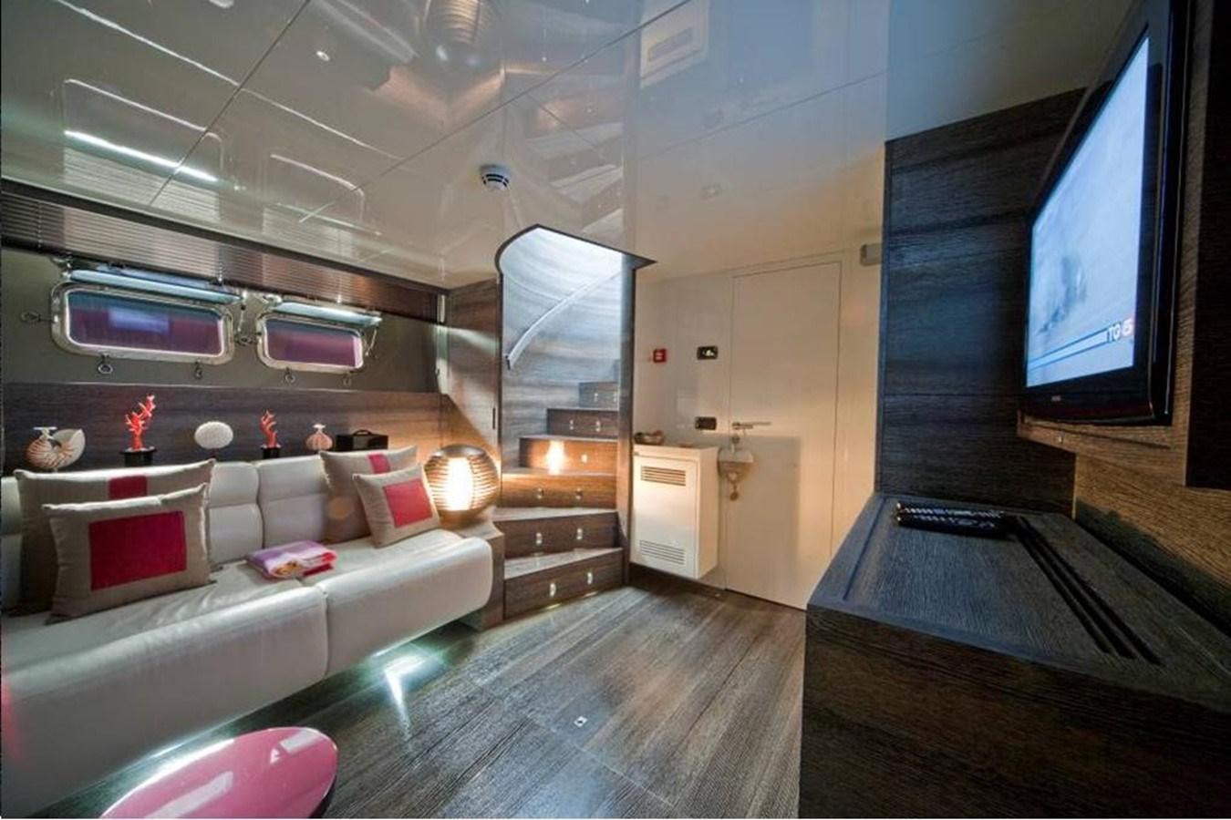 a living room with a large tv aboard TOBY Yacht for Sale