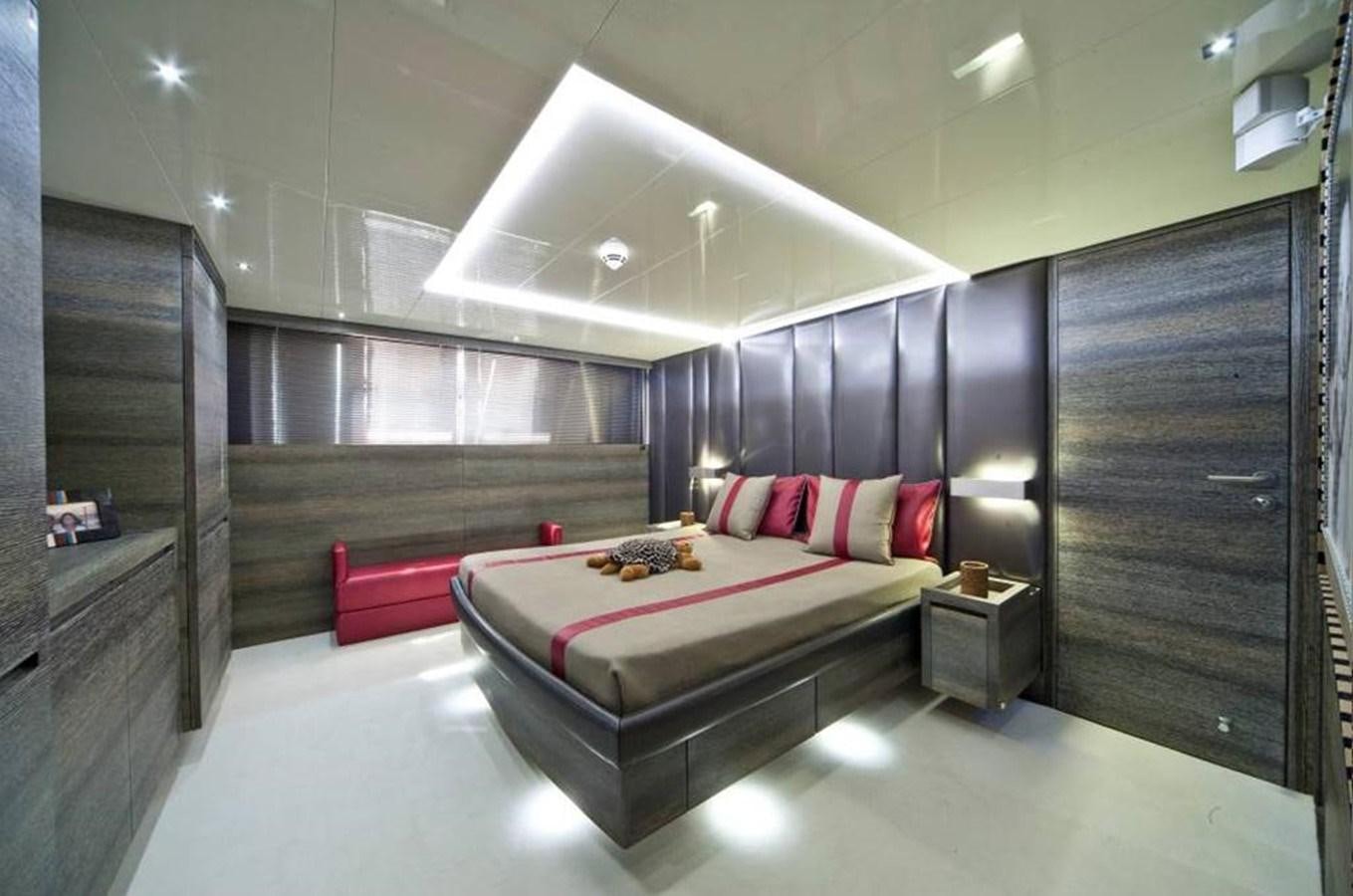 a large bedroom with a large bed aboard TOBY Yacht for Sale