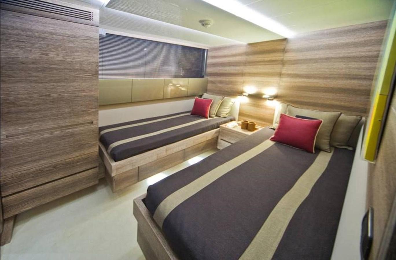 a room with a bed and a couch aboard TOBY Yacht for Sale