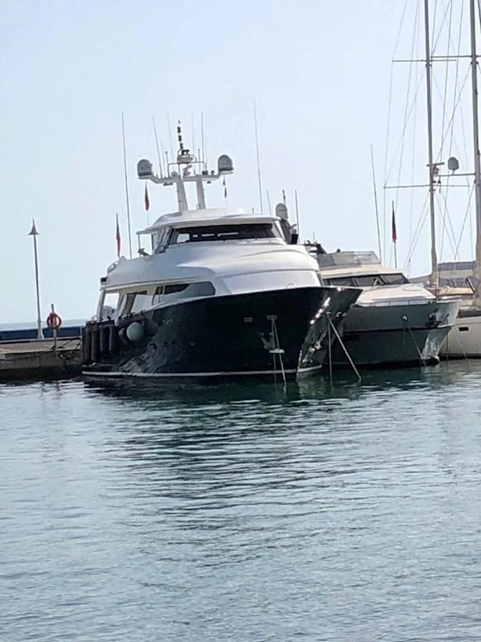 a boat docked at a pier aboard GIHRAMAR Yacht for Sale