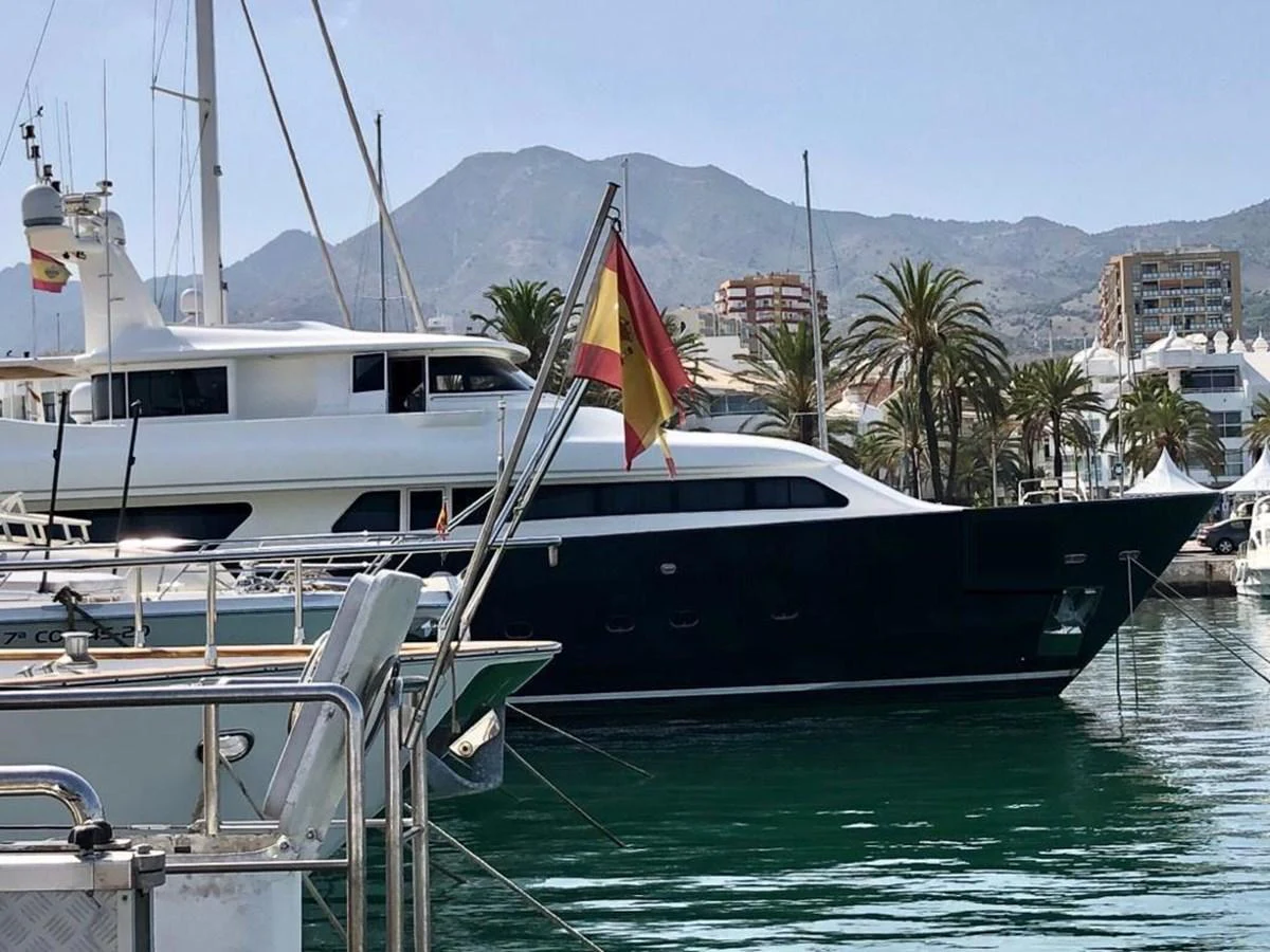 a boat docked at a pier aboard GIHRAMAR Yacht for Sale