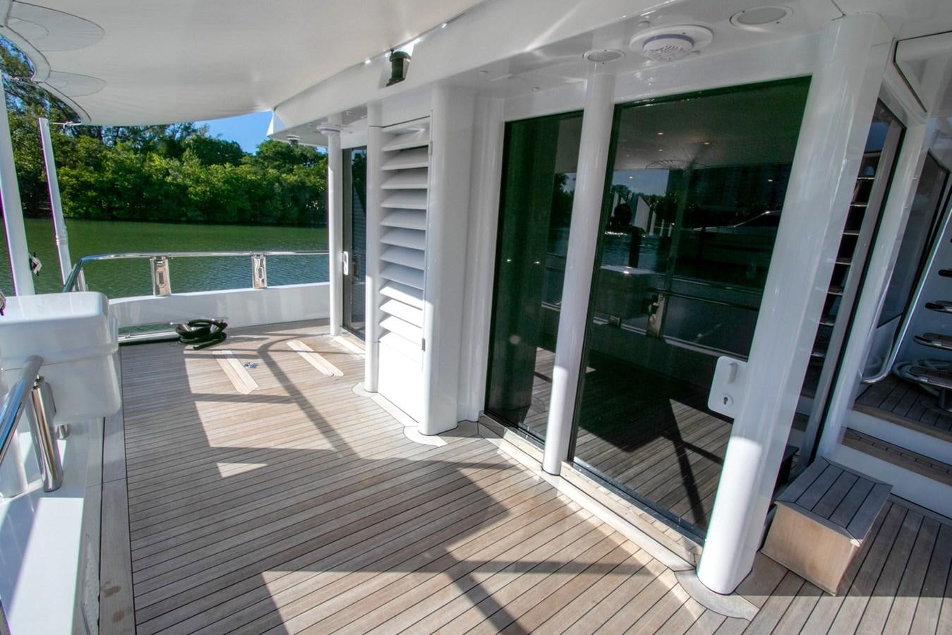a white house with a deck aboard HIGH LINE Yacht for Sale