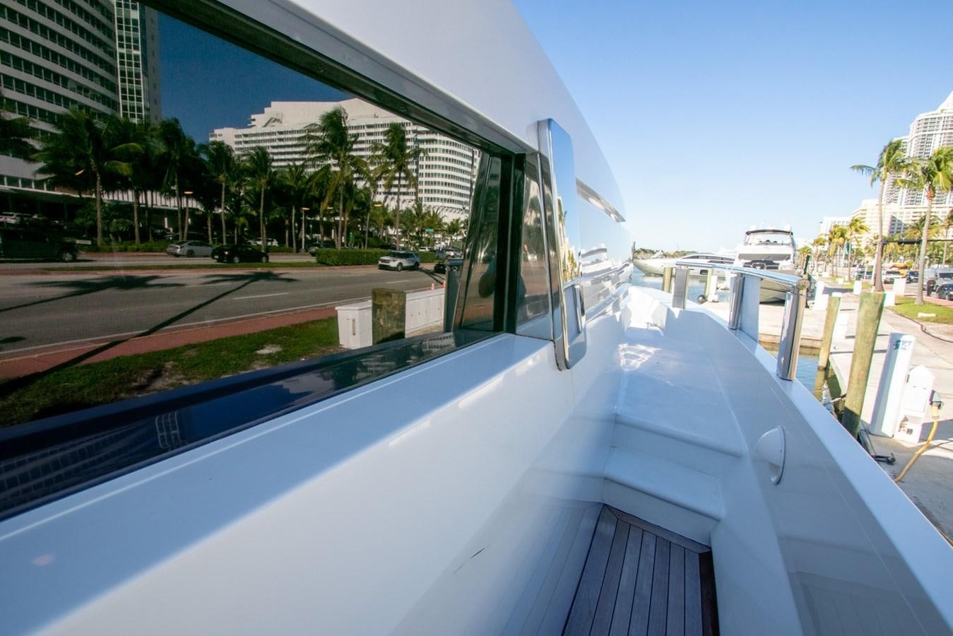 a large building with a pool aboard HIGH LINE Yacht for Sale