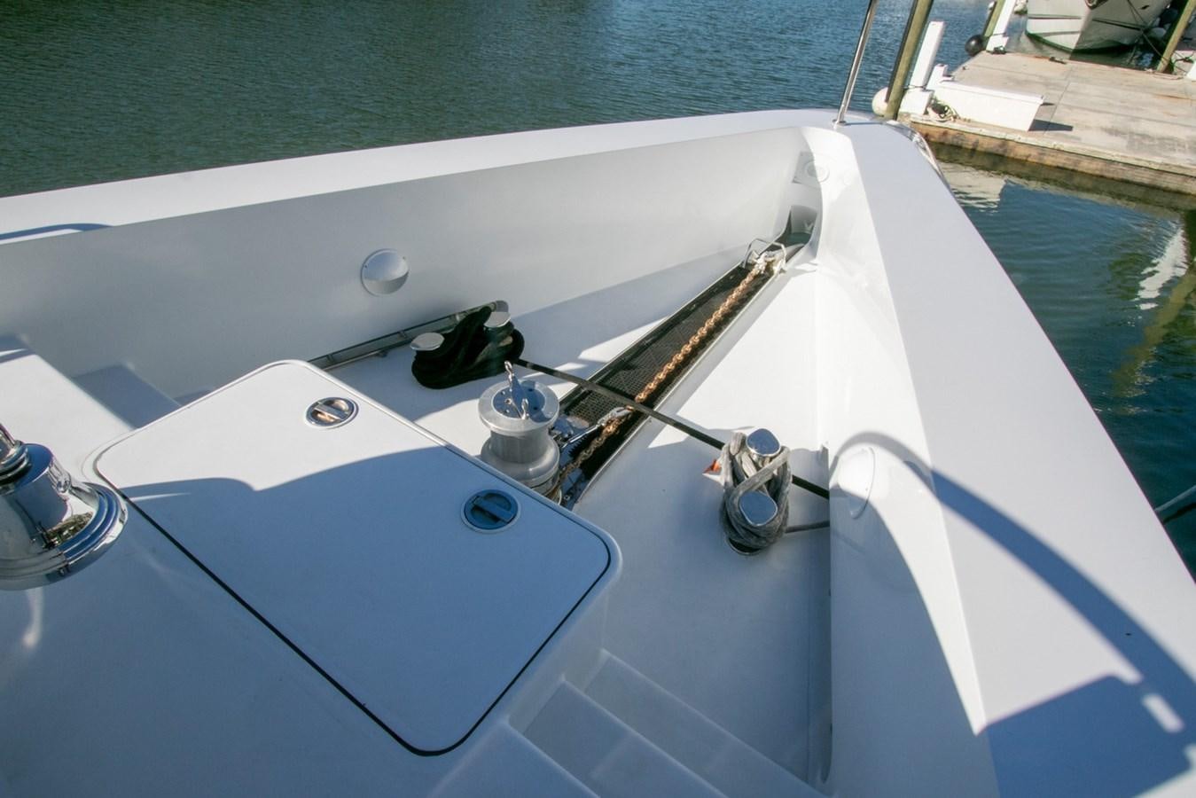a boat with a bottle on the front aboard HIGH LINE Yacht for Sale