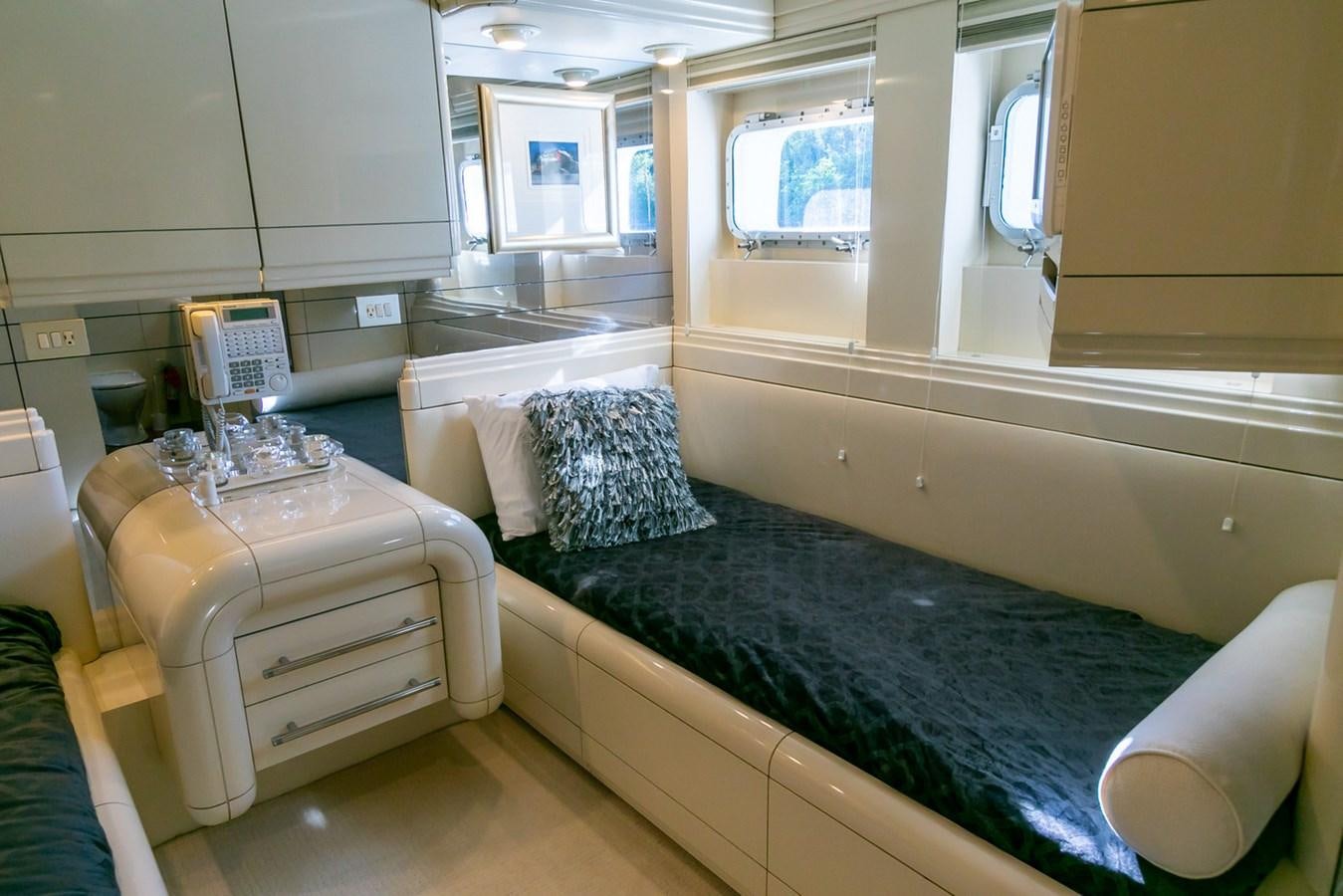 a room with a bed and a table aboard HIGH LINE Yacht for Sale