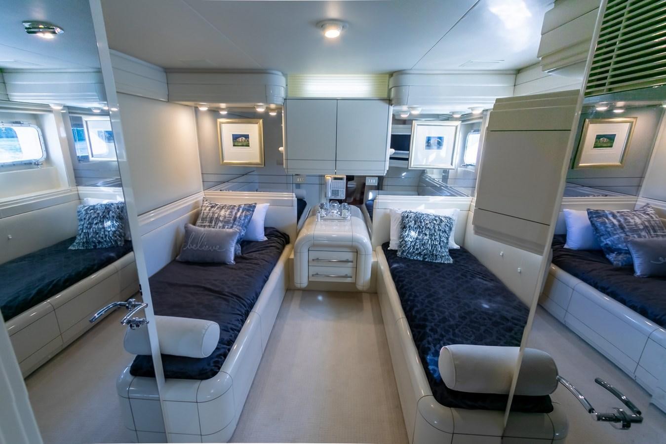 a room with a bed and a couch aboard HIGH LINE Yacht for Sale