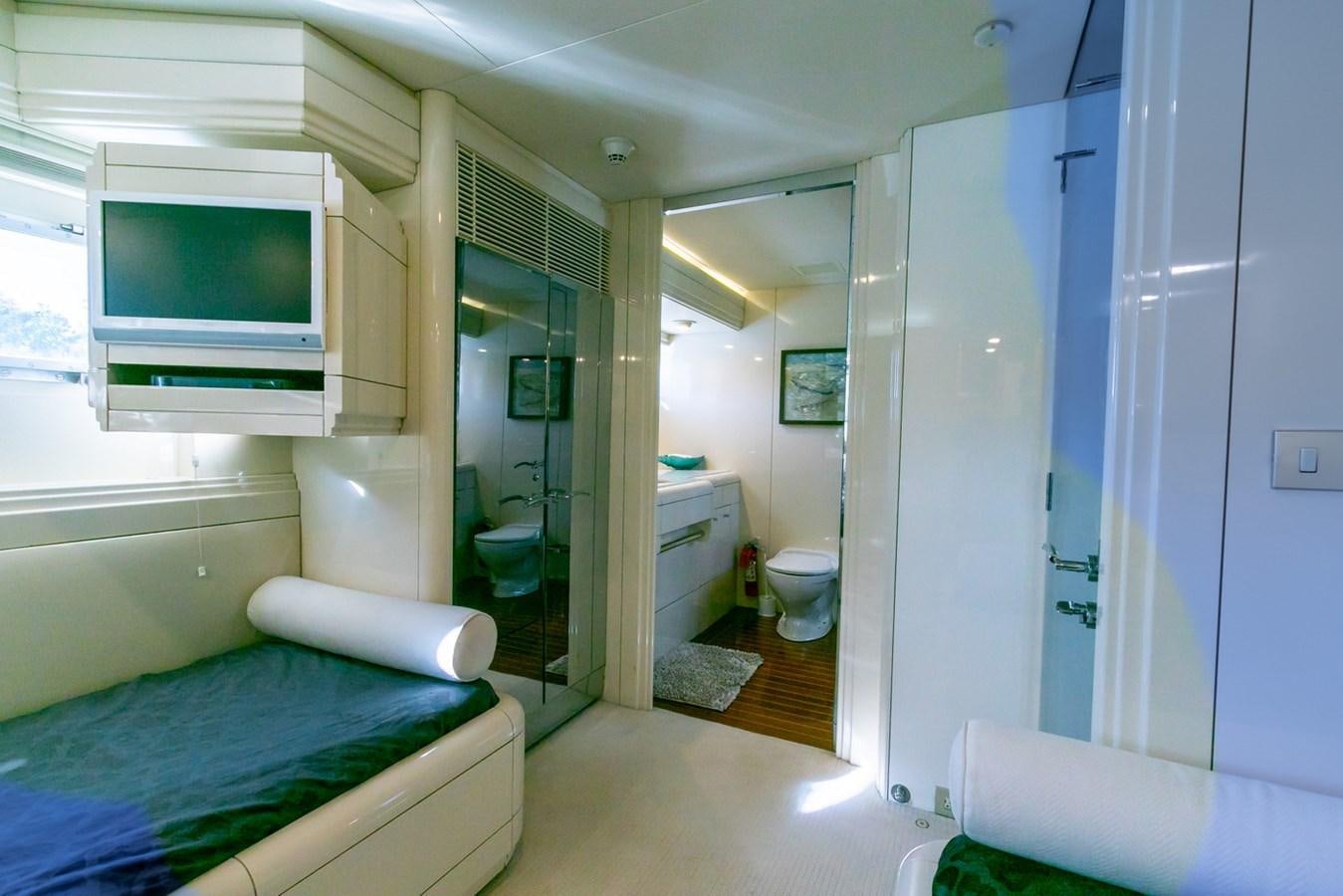 a bedroom with a blue bed aboard HIGH LINE Yacht for Sale