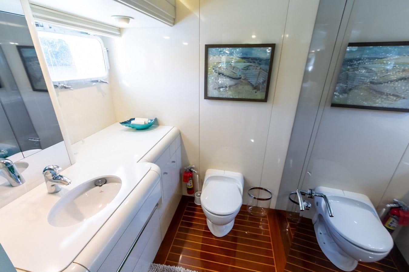 a bathroom with a sink toilet and a bathtub aboard HIGH LINE Yacht for Sale