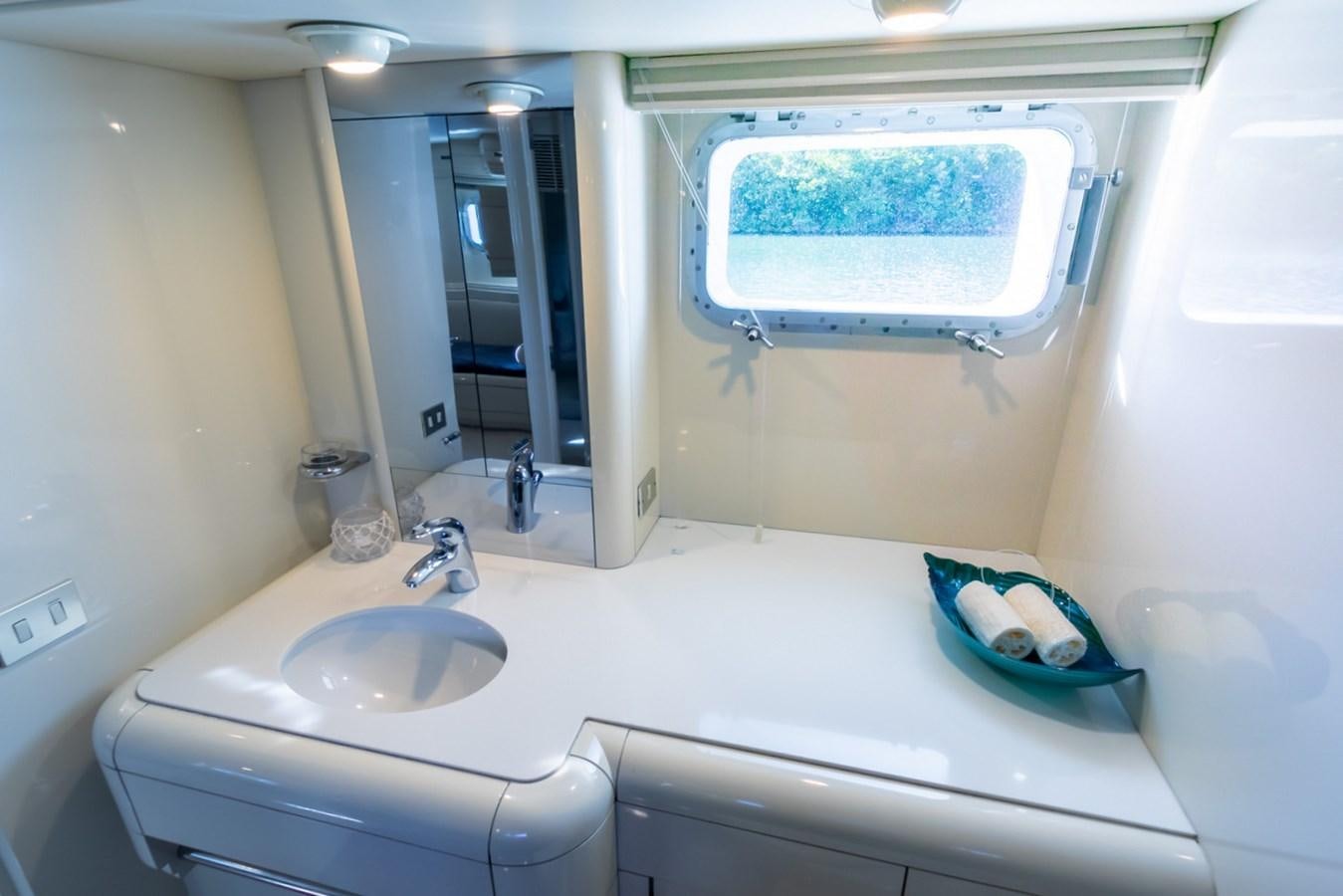 a bathroom with a sink and a mirror aboard HIGH LINE Yacht for Sale