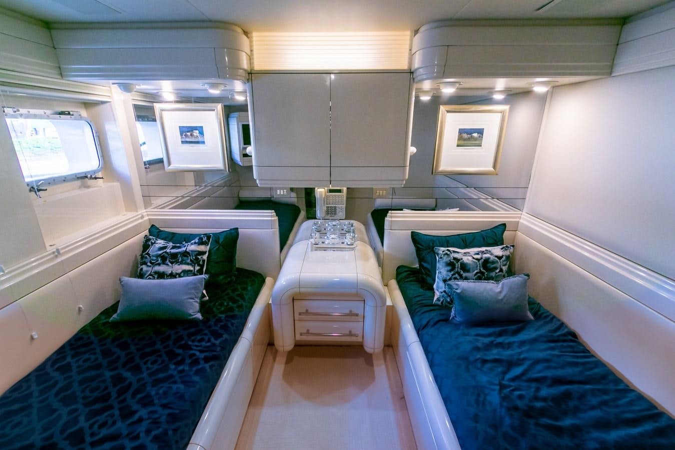 a room with beds and a desk aboard HIGH LINE Yacht for Sale