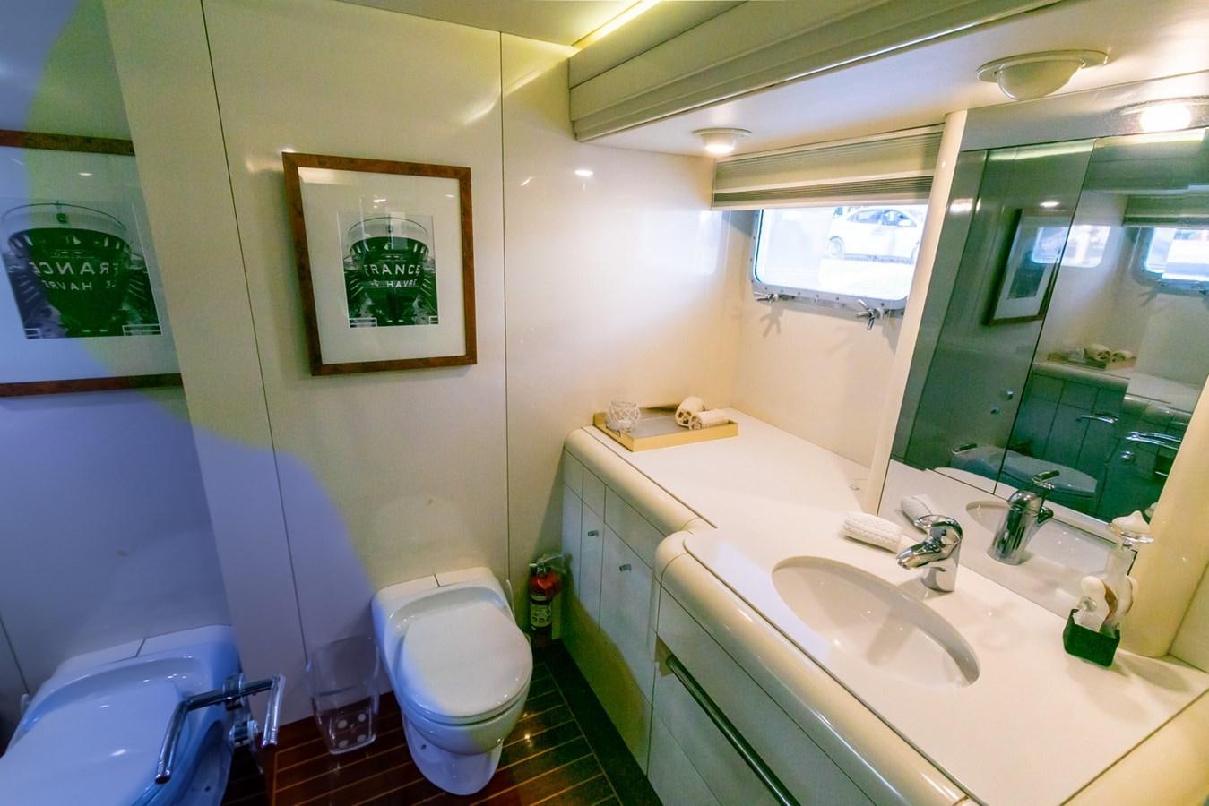 a bathroom with a sink and a toilet aboard HIGH LINE Yacht for Sale
