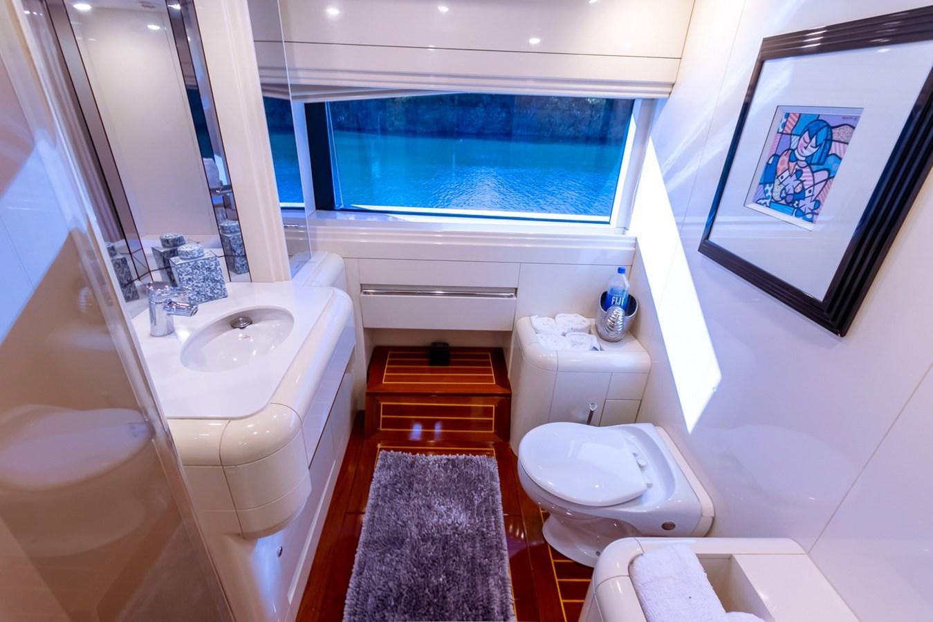 a bathroom with a sink toilet and bathtub aboard HIGH LINE Yacht for Sale