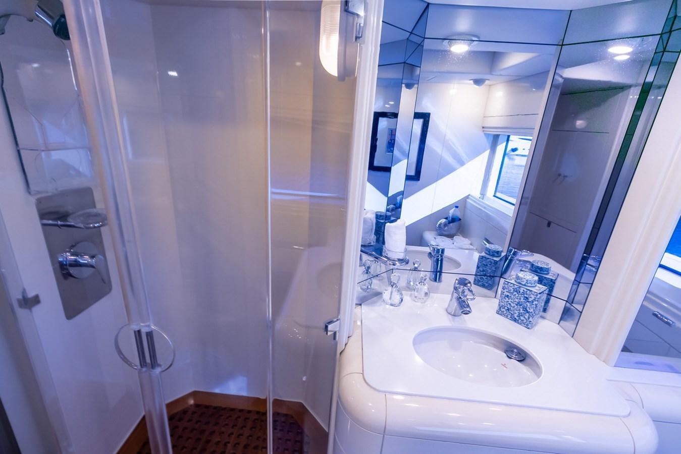 a bathroom with a sink and a mirror aboard HIGH LINE Yacht for Sale