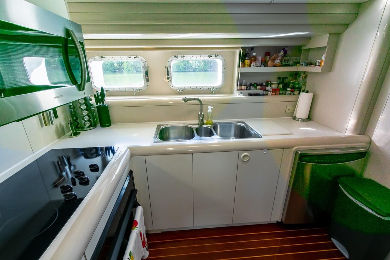 a kitchen with a sink and cabinets aboard HIGH LINE Yacht for Sale