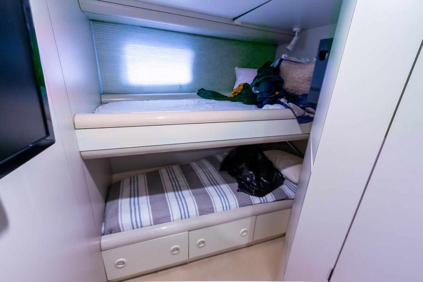 a shelf with clothes on it aboard HIGH LINE Yacht for Sale