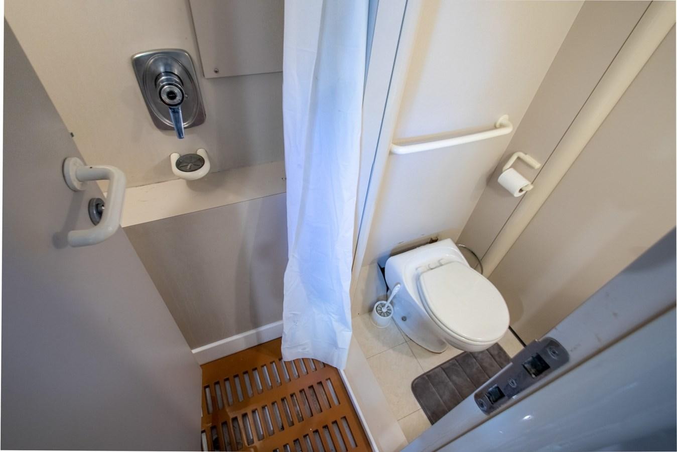 a toilet with a seat up aboard HIGH LINE Yacht for Sale