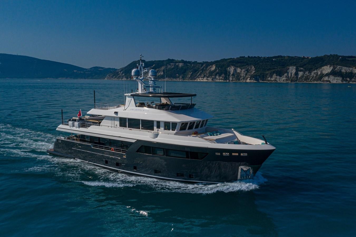 a boat on the water aboard DARWIN CLASS 102 Yacht for Sale