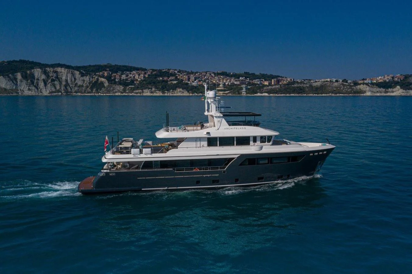 a boat on the water aboard DARWIN CLASS 102 Yacht for Sale