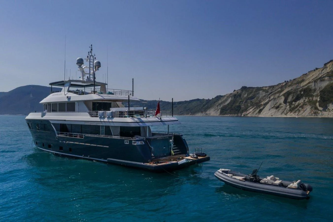 a boat and a boat in the water aboard DARWIN CLASS 102 Yacht for Sale