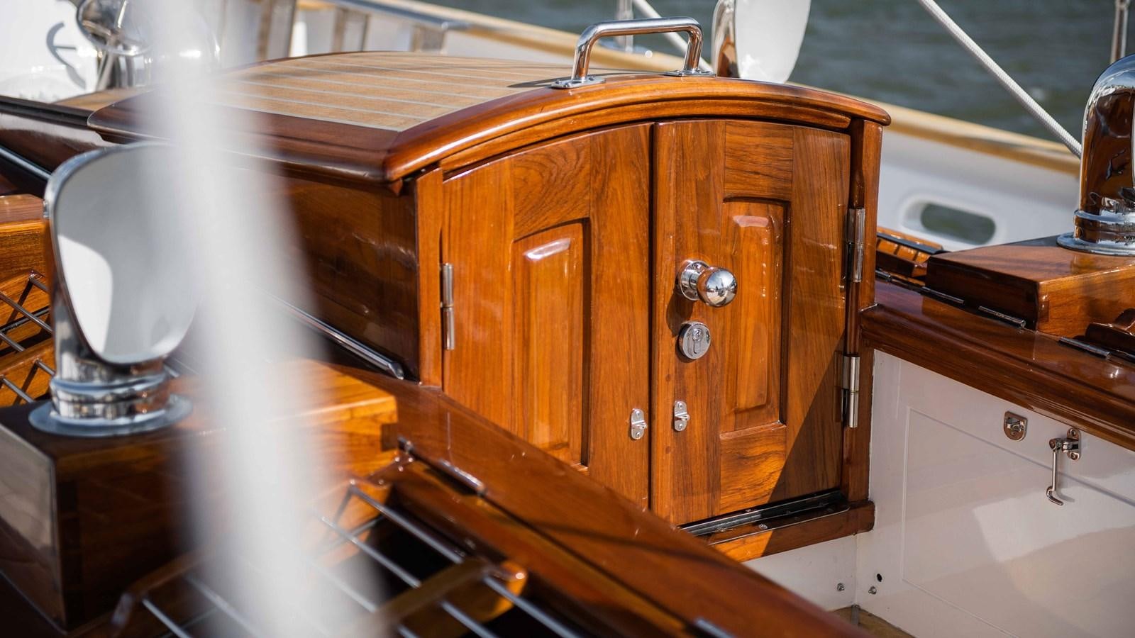 a wooden cabinet with a faucet aboard BORKUMRIFF II Yacht for Sale