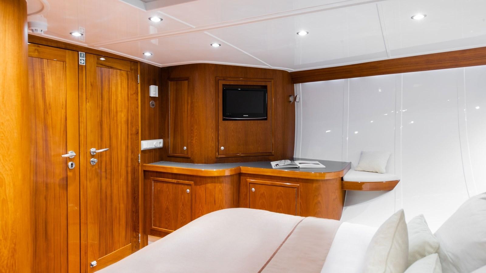 a room with a bed and a television aboard BORKUMRIFF II Yacht for Sale