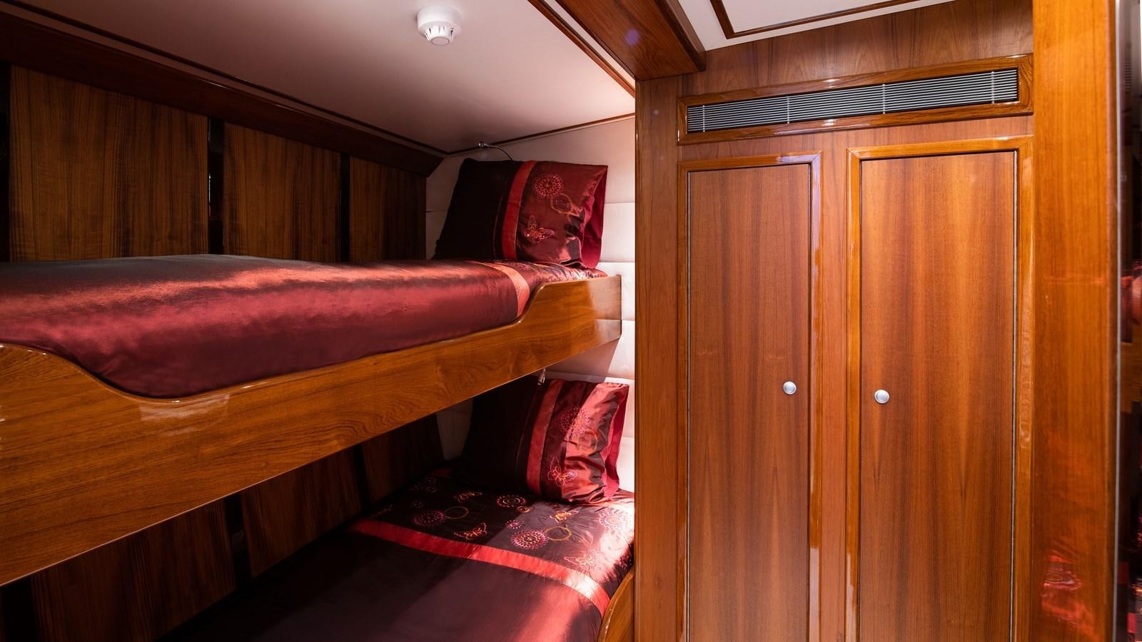 a room with a bed and a closet aboard BORKUMRIFF II Yacht for Sale
